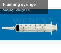 Flushing syringe